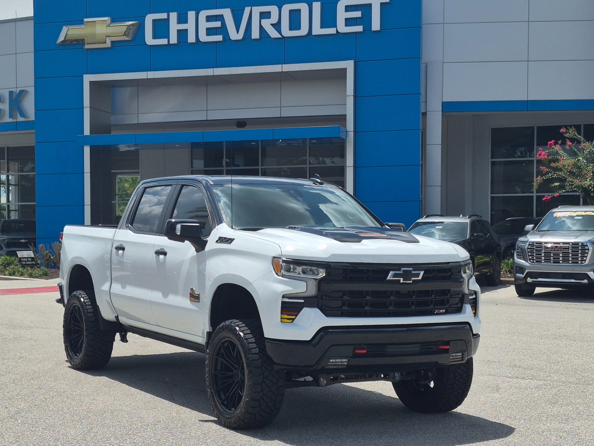 Front three-quarter view of the lifted Unconquered Edition Silverado